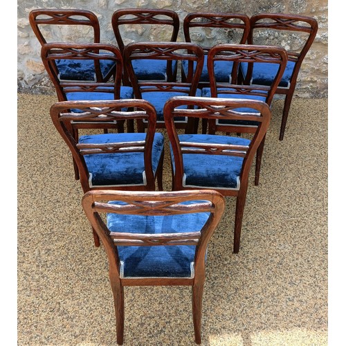 985 - An unusual set of ten Black Forest style carved dining chairs, with padded seats (10)