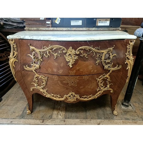963 - A matched pair of French serpentine front bombe commodes, with floral marquetry decoration, ormolu m... 
