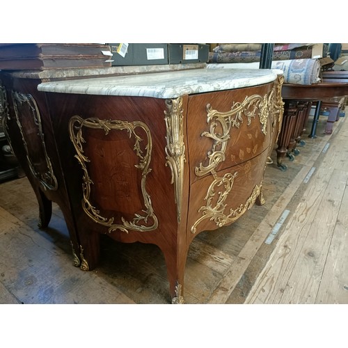 963 - A matched pair of French serpentine front bombe commodes, with floral marquetry decoration, ormolu m... 