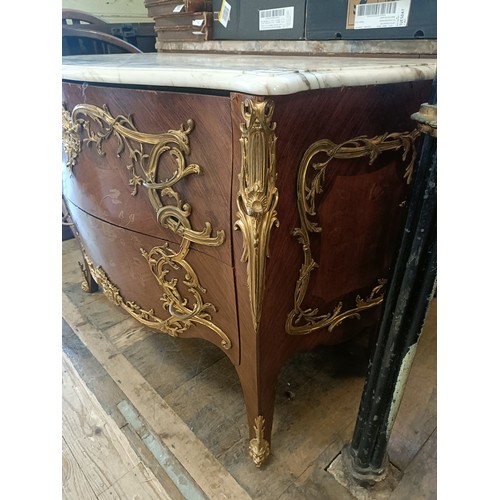963 - A matched pair of French serpentine front bombe commodes, with floral marquetry decoration, ormolu m... 