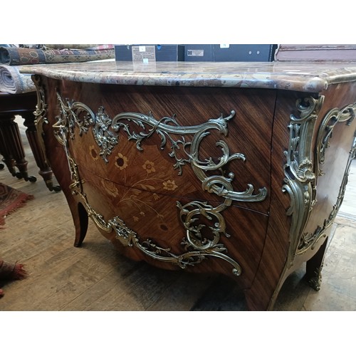 963 - A matched pair of French serpentine front bombe commodes, with floral marquetry decoration, ormolu m... 