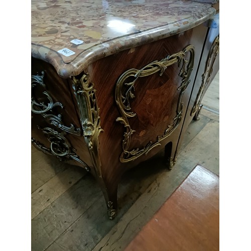 963 - A matched pair of French serpentine front bombe commodes, with floral marquetry decoration, ormolu m... 