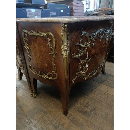 963 - A matched pair of French serpentine front bombe commodes, with floral marquetry decoration, ormolu m... 