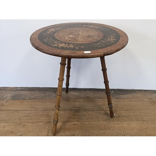 1000 - An Italian Sorento type table, on faux bamboo legs, 57 cm diameter