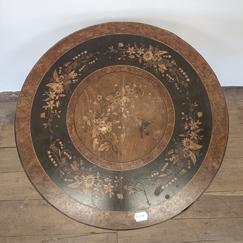 1000 - An Italian Sorento type table, on faux bamboo legs, 57 cm diameter
