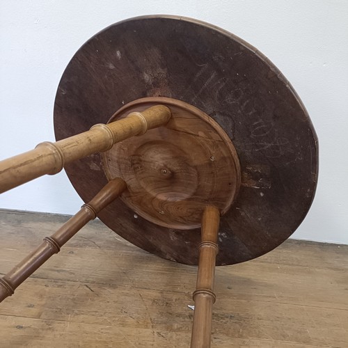 1000 - An Italian Sorento type table, on faux bamboo legs, 57 cm diameter