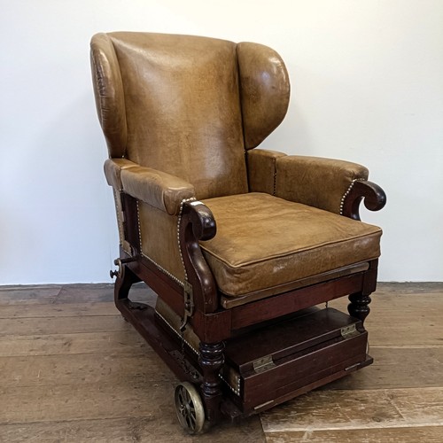965 - A 19th century invalids reclining leather upholstered armchair, with brass mounts and wheels, J Ward... 