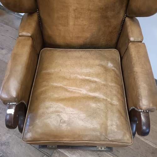 965 - A 19th century invalids reclining leather upholstered armchair, with brass mounts and wheels, J Ward... 