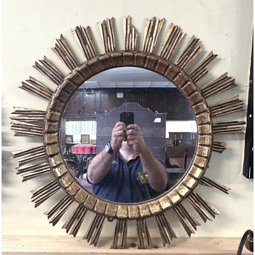 901 - A gilt carved wood round wall mirror, 63 cm diameter and another 63 cm (2)