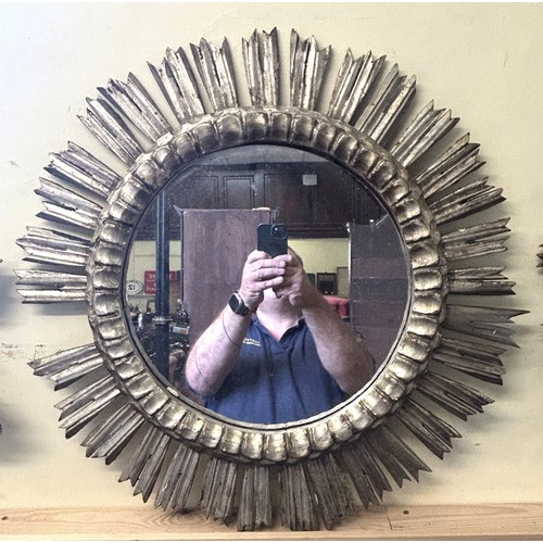 901 - A gilt carved wood round wall mirror, 63 cm diameter and another 63 cm (2)