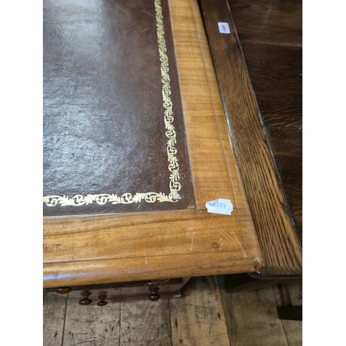 980 - A mahogany pedestal desk, of nine drawer configuration, 133 cm wide