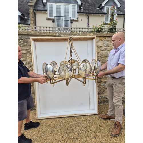 998 - A large gilt metal and mirrored chandelier, with corded supports, 105 cm diameter