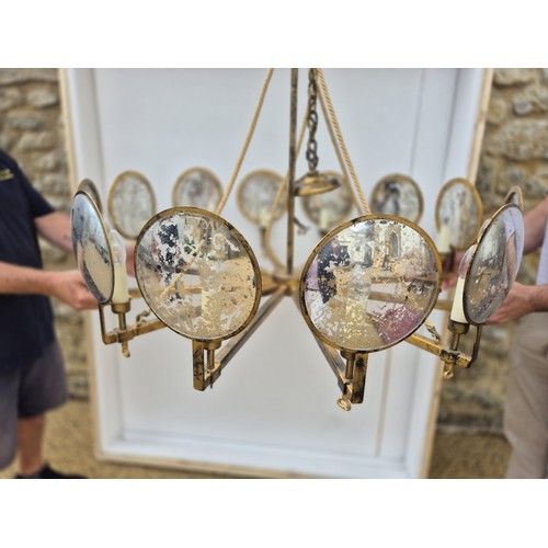 998 - A large gilt metal and mirrored chandelier, with corded supports, 105 cm diameter