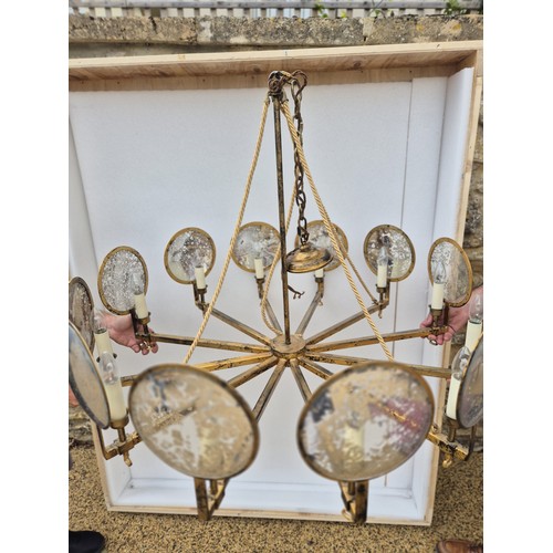 998 - A large gilt metal and mirrored chandelier, with corded supports, 105 cm diameter