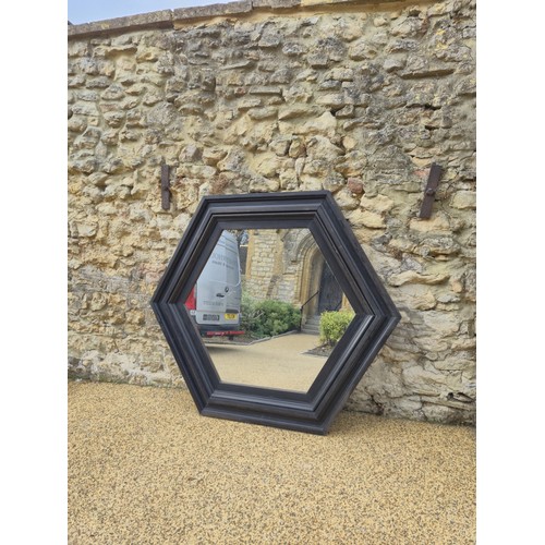 1006 - A large octagonal wall mirror, with a painted wooden frame, 150 cm wide