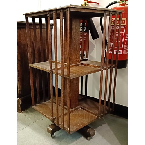 982 - An oak revolving bookcase. 46 cm wide