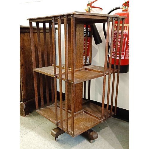 982 - An oak revolving bookcase. 46 cm wide