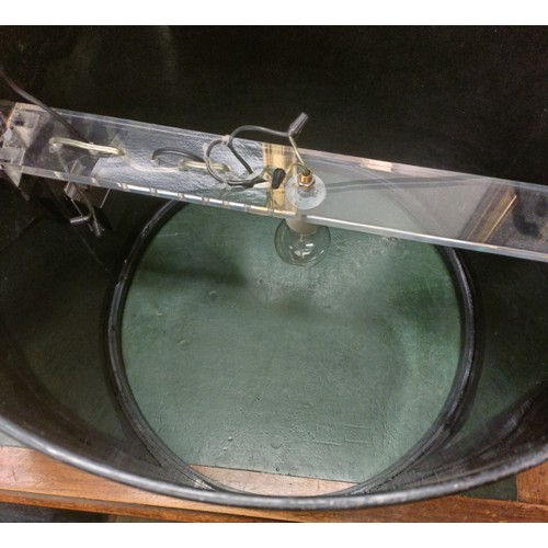 1009 - A large black plastic side table, 56 cm diameter, with a frosted Perspex round base, 54 cm diameter ... 