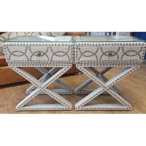 1016 - A pair of cloth covered and studded bedside tables, connected as one, each 50 cm wide