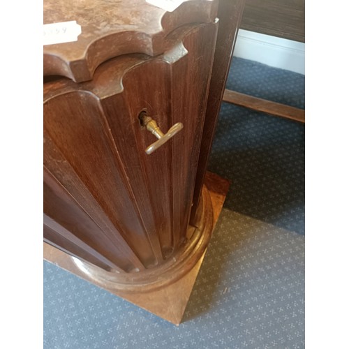 1017 - A pair of walnut bedside cupboards, in the form of fluted columns, 40 cm diameter, 89 cm high