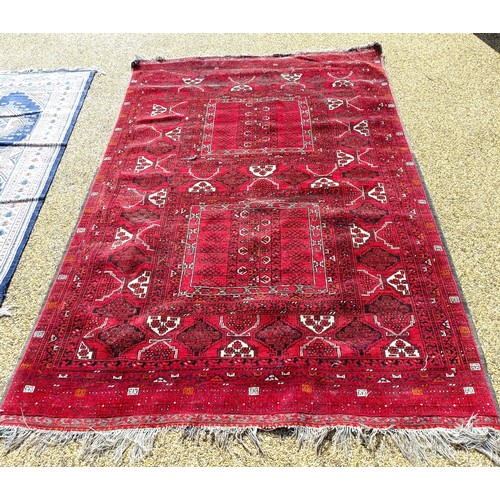 966 - A red ground carpet, 254 cm x 166 cm, and a blue ground rug, 193 cm x 132 cm (2)