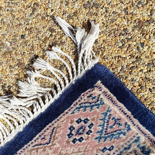 966 - A red ground carpet, 254 cm x 166 cm, and a blue ground rug, 193 cm x 132 cm (2)