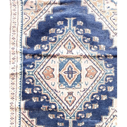 966 - A red ground carpet, 254 cm x 166 cm, and a blue ground rug, 193 cm x 132 cm (2)