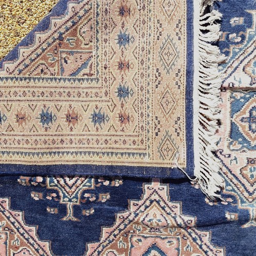 966 - A red ground carpet, 254 cm x 166 cm, and a blue ground rug, 193 cm x 132 cm (2)
