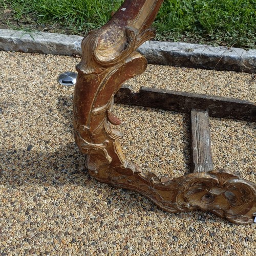 1005 - A 19th century carved wood and gesso pier table, in the rococo manner, 58 cm wide, lacking a marble ... 