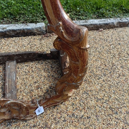 1005 - A 19th century carved wood and gesso pier table, in the rococo manner, 58 cm wide, lacking a marble ... 