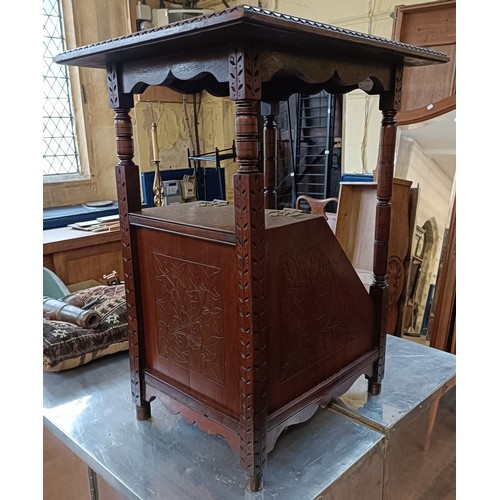 978 - An aesthetic period walnut coal purdonium, carved foliate forms, 60 cm high x 34 cm wide