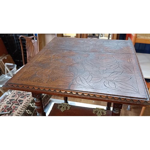 978 - An aesthetic period walnut coal purdonium, carved foliate forms, 60 cm high x 34 cm wide