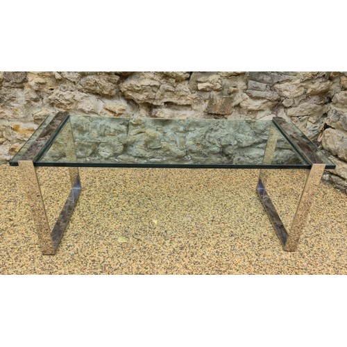 1014 - A contemporary glass and chrome coffee table, 44 cm high, 124 cm wide