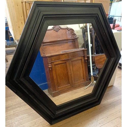 1006 - A large octagonal wall mirror, with a painted wooden frame, 150 cm wide