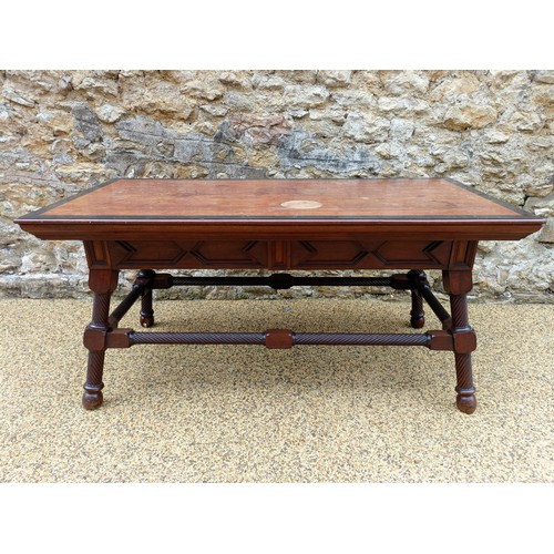 993 - Attributed to George Faulkner Armitage, a mahogany and ebonised library table, with two frieze drawe... 