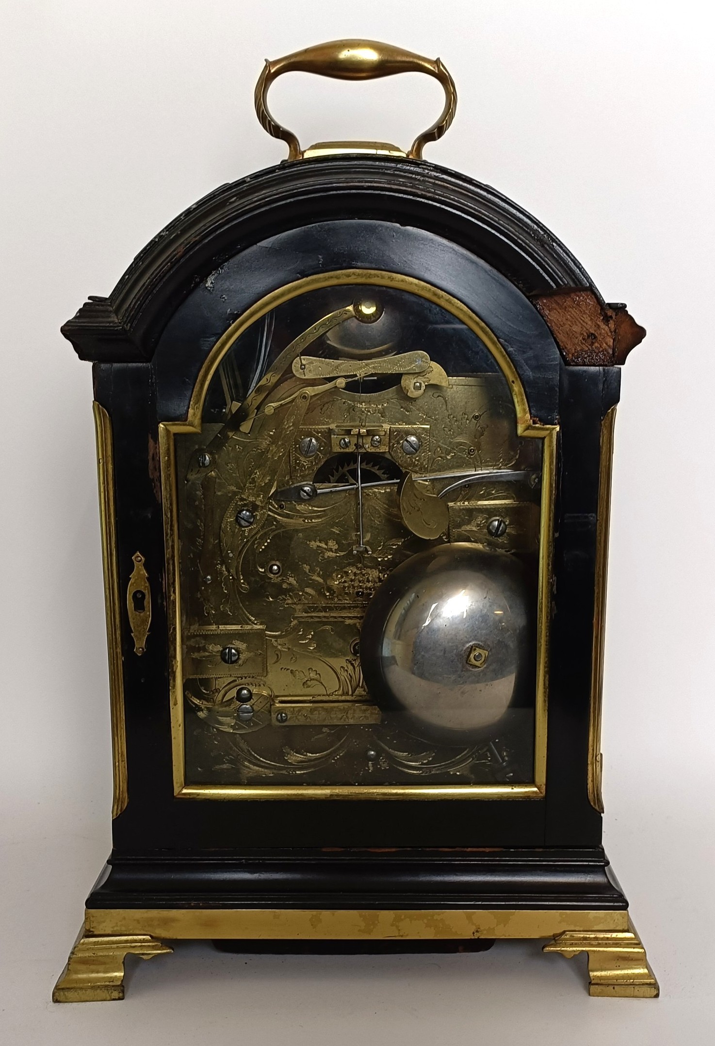 A musical bracket clock, with repeat, the 12 cm wide arched square dial ...