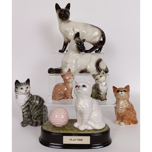 71 - A Beswick Persian Kitten, seated, ginger striped, 1886, a Cat, grey striped, 1031, two Kittens, ging... 