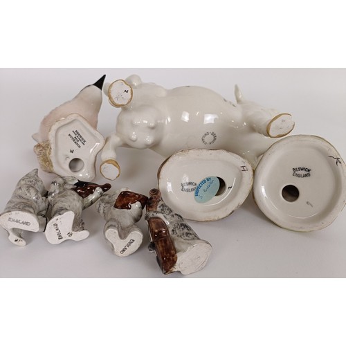 73 - A Beswick cow creamer, four Cat Orchestra figures, 1026, 1027, 1028 and 1029, a Harvest Mouse, 3397,... 