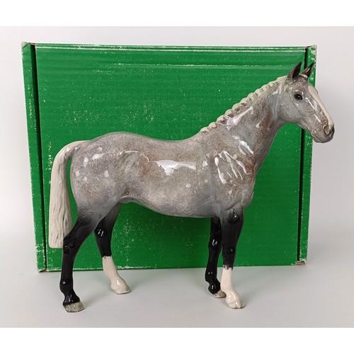 75 - A Beswick Hunter, grey, H260, (boxed) a Palomino, H259, Another Bunch, (boxed) and a Royal Doulton S... 