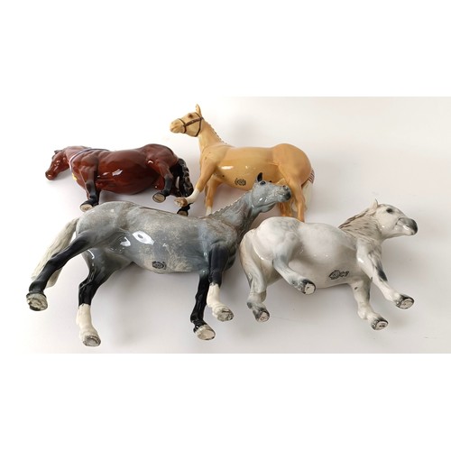 75 - A Beswick Hunter, grey, H260, (boxed) a Palomino, H259, Another Bunch, (boxed) and a Royal Doulton S... 