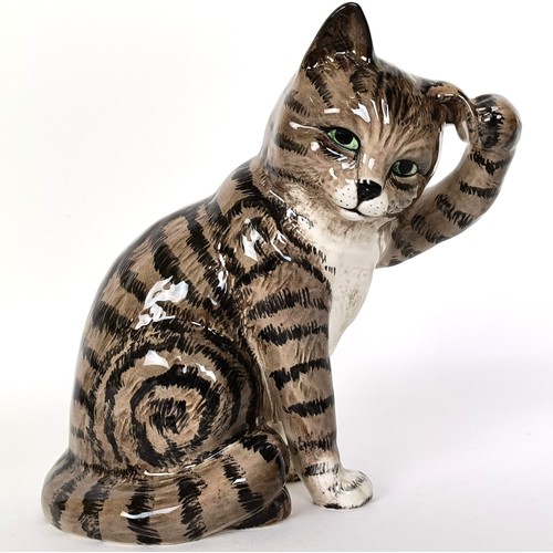 65 - A Beswick Cat, seated scratching ear, grey Swiss roll, 1877, gloss