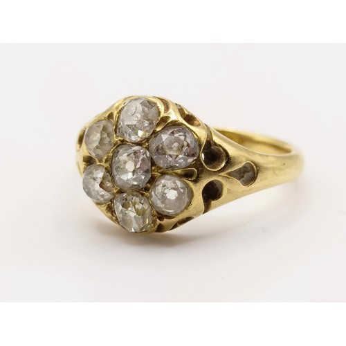 667 - An 18ct gold and diamond flowerhead ring, ring size M