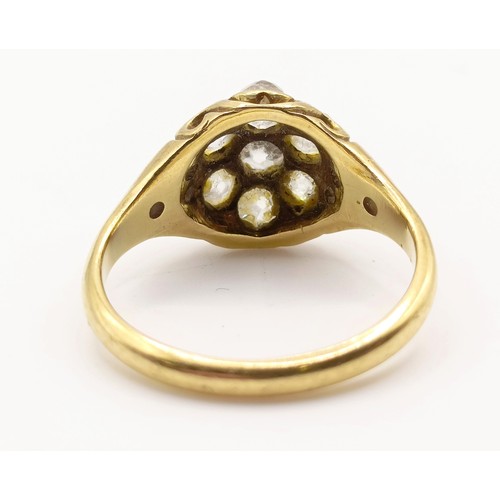 667 - An 18ct gold and diamond flowerhead ring, ring size M