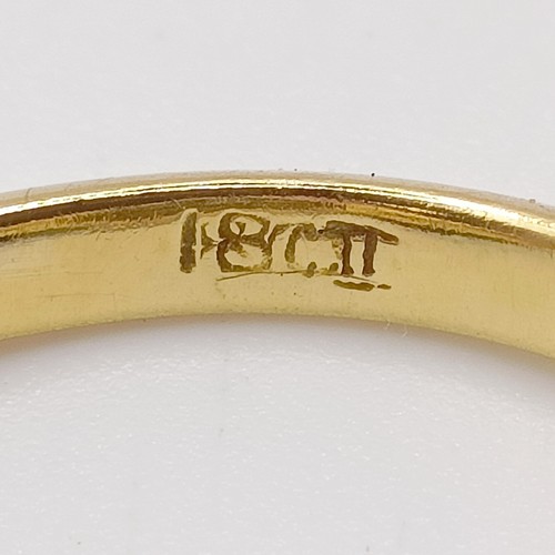 667 - An 18ct gold and diamond flowerhead ring, ring size M