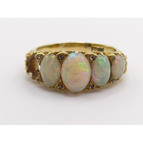 669 - An 18ct gold and five stone opal ring, one opal missing, ring size N
