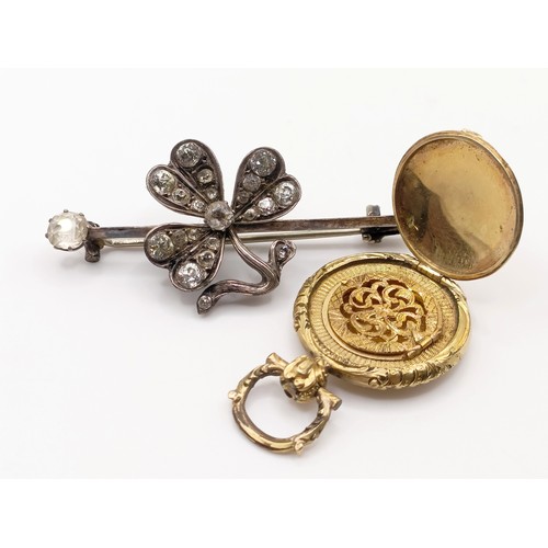 671 - A yellow metal pendent, testing as 9ct, 7.9 g and a bar brooch (2)