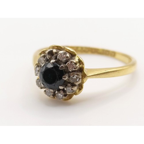 677 - An 18ct gold, diamond and sapphire cluster ring, ring size L1/2