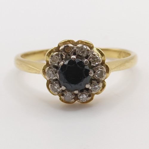 677 - An 18ct gold, diamond and sapphire cluster ring, ring size L1/2
