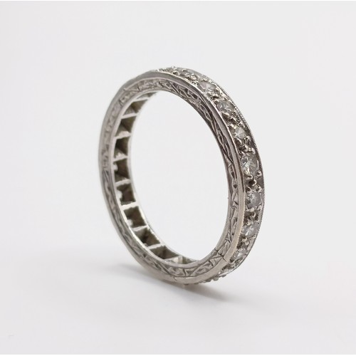 679 - A yellow coloured metal and diamond eternity ring, ring size J