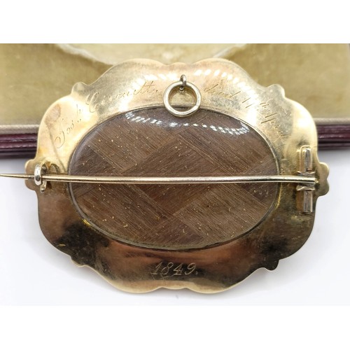 687 - A Victorian yellow coloured metal, blue enamel and seed pearl memorial brooch, 6 cm wide, inset with... 